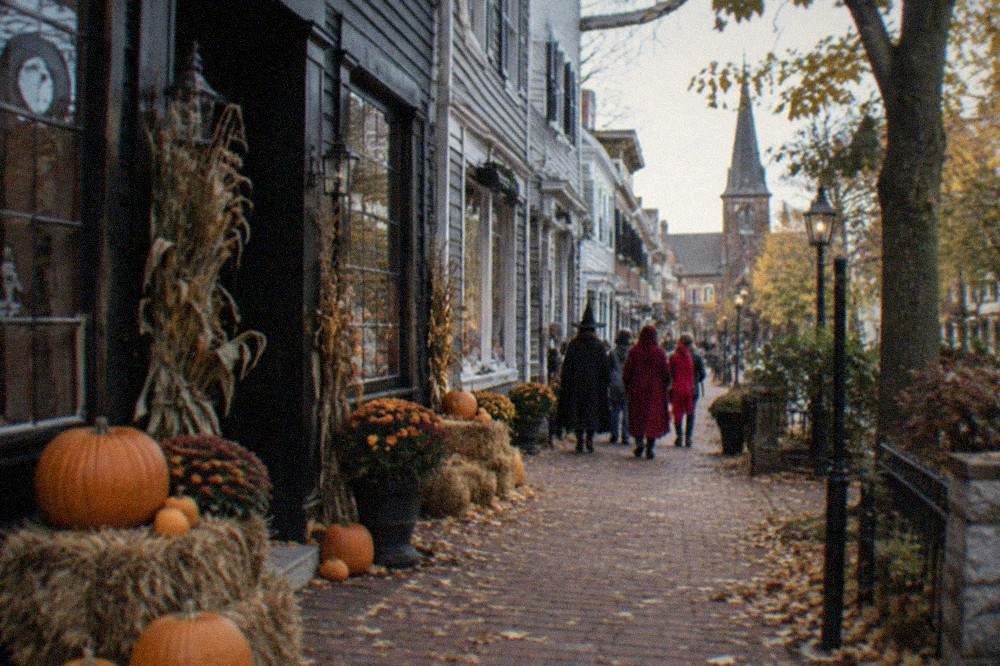 Crowds of visitors walking along a decorated downtown Salem street in autumn