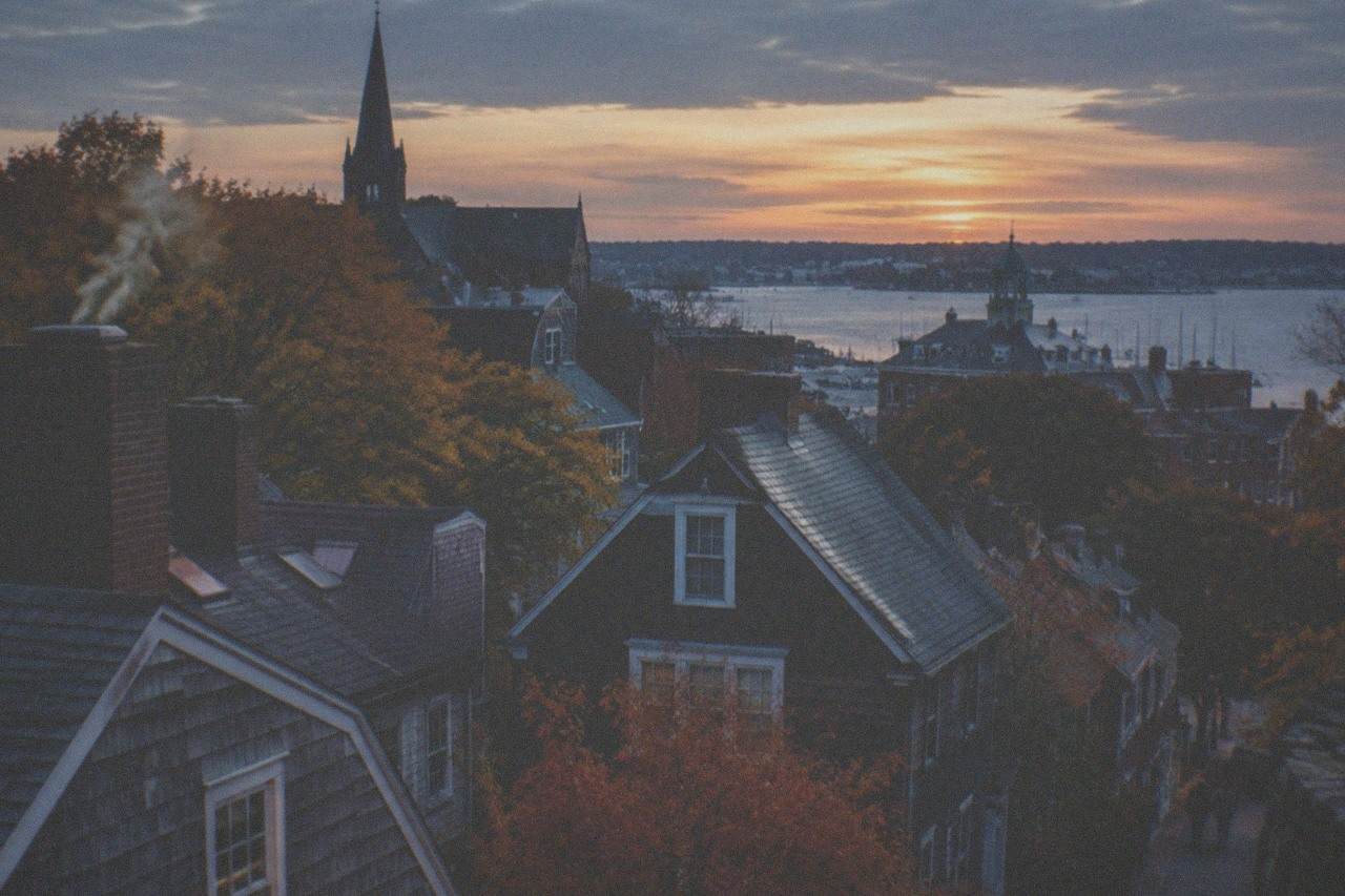 Autumn leaves and old rooftops in downtown Salem at dusk