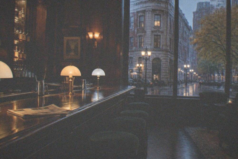 Elegant historic hotel bar with dark wood panels and vintage light fixtures